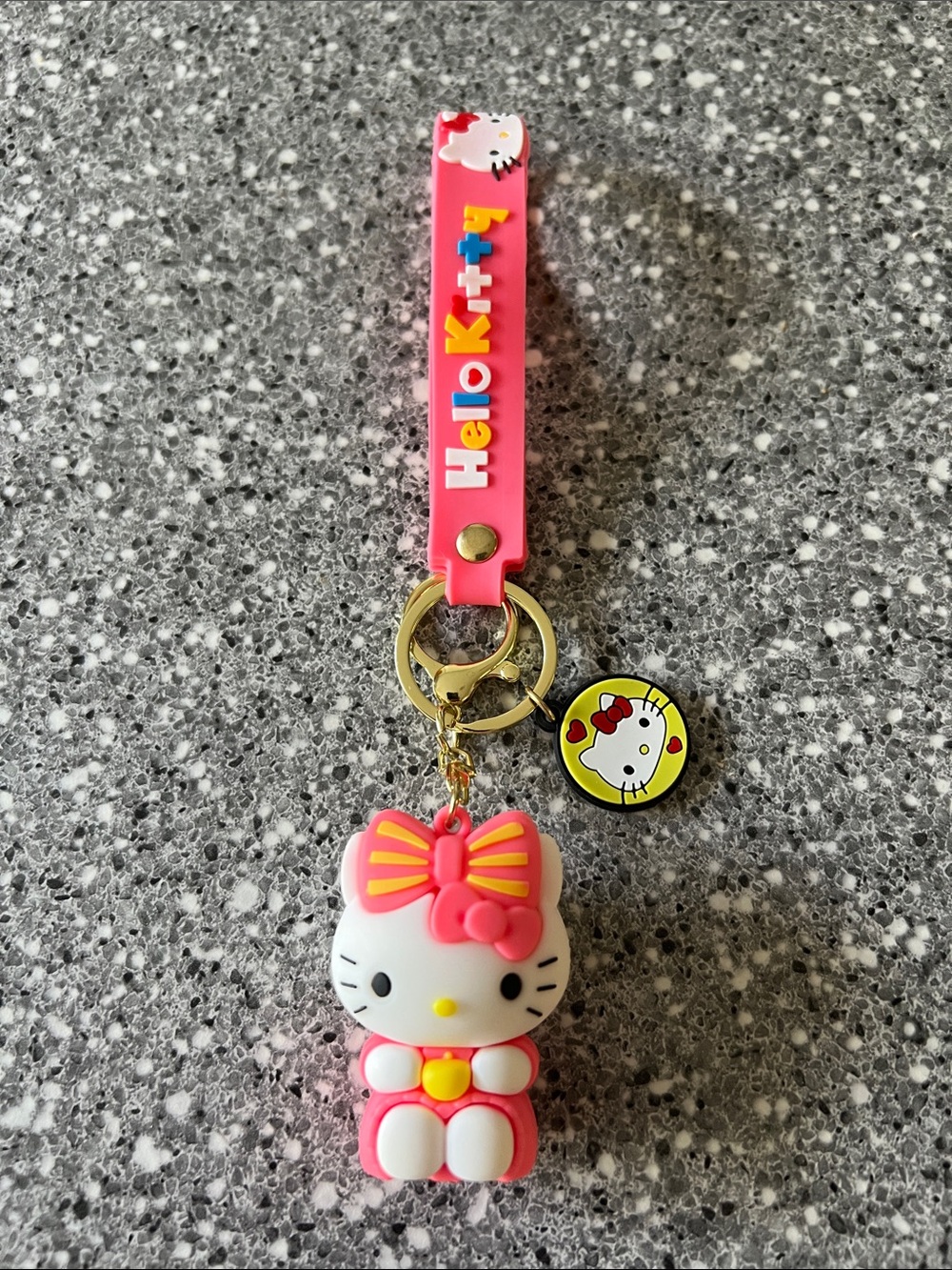 Sanrio Hello Kitty Pink and Yellow Rubber Keychain with Gold Hardware